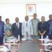 Hon. Sampson Ahi, Deputy Minister for Trade, Agribusiness and Industry, with Dr. Lawrence Kannea, Civil Service Council Chairman, and Representatives