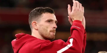 Andy Robertson applauds the fans at Anfield