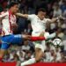 Kylian Mbappe battles for the ball