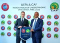 UEFA President, Aleksander Cefrin (left) and CAF President Dr. Patrice Motsepe share a handshake
