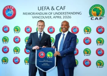 UEFA President, Aleksander Cefrin (left) and CAF President Dr. Patrice Motsepe share a handshake