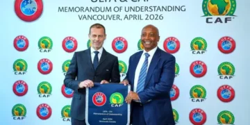 UEFA President, Aleksander Cefrin (left) and CAF President Dr. Patrice Motsepe share a handshake