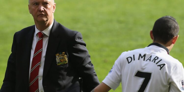 Angel Di Maria shakes manager Luis Van Gaal after a Premier League game