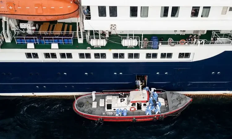 Three Hantavirus Patients Evacuated from Cruise Ship 1 The evacuation boat alongside the MV Hondius