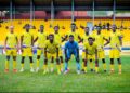 Medeama SC players pose for a pre-match team photo at the TnA Stadium in Tarkwa