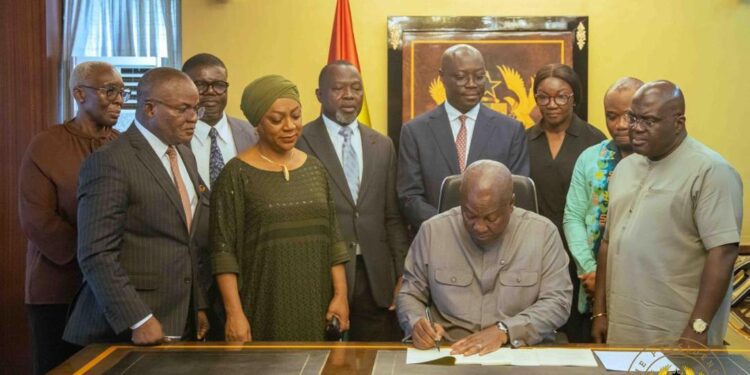 Picture of HE President John Dramani Mahama and other Government Officails signing the Value for Money Office Bill 2026 into law