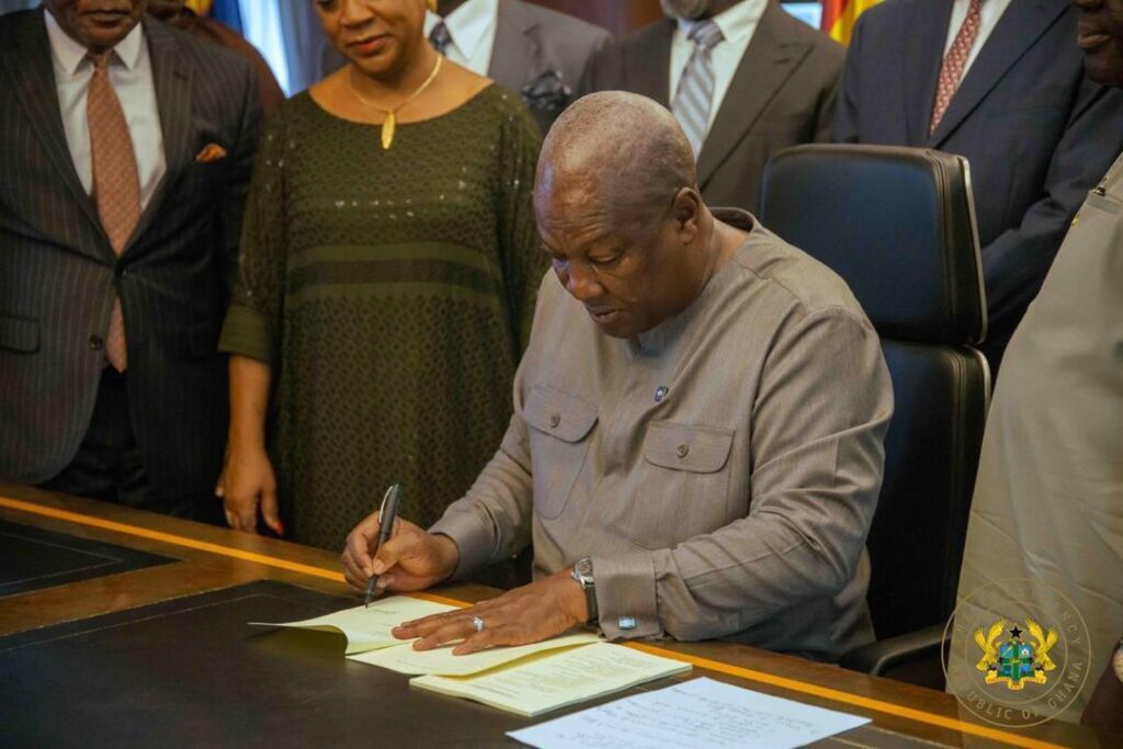 Picture of HE President John Dramani Mahama  and other Government Officails signing the  Value for Money Office Bill 2026 into law