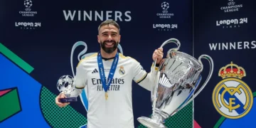Dani Carvajal displays the Uefa Champions League trophy together with his man of the match award in 2024 UCL final