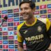 Marcelino smiling as he takes his seat at a pre-match presser