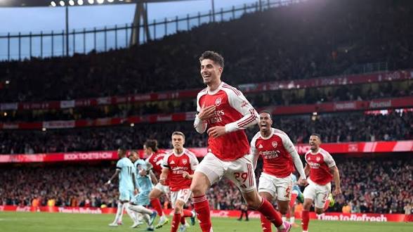 Arsenal Secure 14th Premier League Title After City Slip at Bournemouth 1 Kai Harvetz leads Arsenal celebrations after scoring against Burnley at the Emirates Stadium