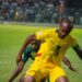 Jordan Ayew protects the ball from the Comoros defender in the World Cup qualifier at the Accra Sports Stadium