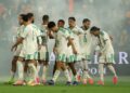 Players of the Desert Foxes celebrate with Hadj Moussa after he scored the winning goal against the Netherlands in Rotherdam