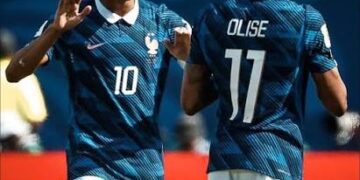 Kylian Mbappé and Michael Olise in action for France