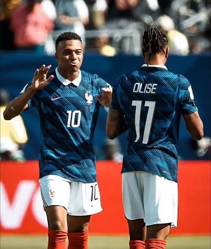 Kylian Mbappé and Michael Olise in action for France