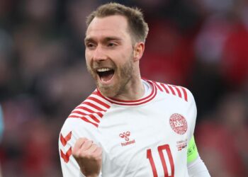 Christian Eriksen celebrates after scoring a stunner