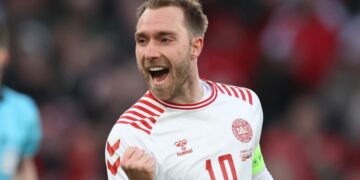 Christian Eriksen celebrates after scoring a stunner