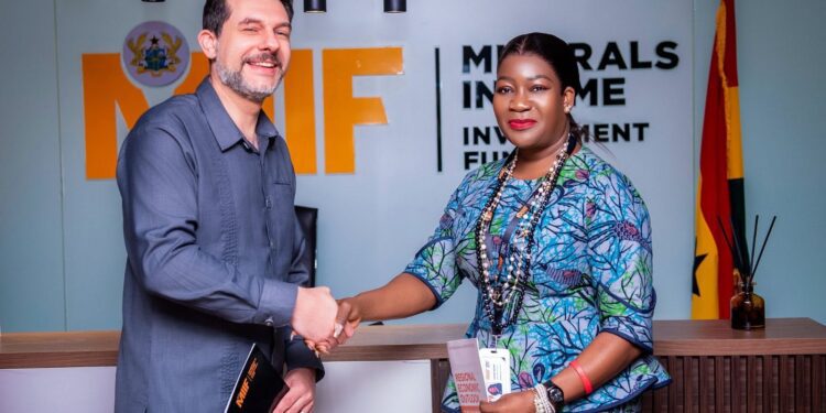 MIIF CEO, Mrs. Justina Nelson with IMF Resident Representative, Dr Adrian Alter