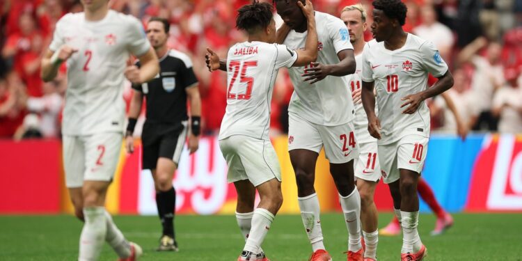 Canada Qualify for WC Knockout Round For The First Time Despite Defeat 1 Canada players celebrating after making knockout round of the FIFA World Cup for the first time in their history
