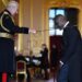 King Charles III knighting Idris Elba