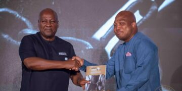 President John Dramani Mahama receiving the roadmap from the Next Step Conference from Minister for Foreign Affairs, Samuel Okudzeto Ablakwa