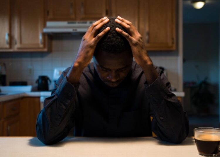 African Men’s Lethal Silence: Stoicism Fuels Suicide Crisis 1 An African man distressed
