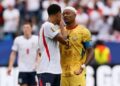 Jude Bellingham caught on camera covering his mouth while talking to Ghana captain Jordan Ayew