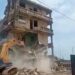 Unsafe Buildings Must Go Down To Protect Lives — NADMO 13 NADMO demolishing a building in Osu.
