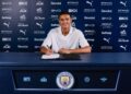 Pierce Charles signing his Manchester City contract