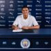 Pierce Charles signing his Manchester City contract