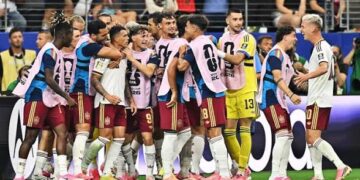 Spain's reserve players run onto the pitch to celebrate after scoring against France in Dallas