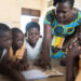 Basic School Children   in Ghana receiving instructions from their teacher