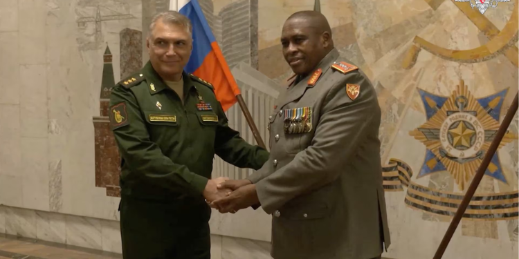 Lieutenant General Lawrence Mbatha, the chief of the South African Army, shakes hands with Russian Colonel General Alexander Matovnikov, deputy commander-in-chief of Russia's land forces