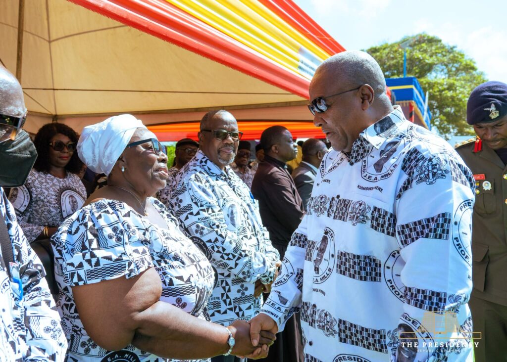 President John Dramani Mahama exchanges greetings with members of the late President John Evans Atta Mills' family during the memorial service at Asomdwee Park.