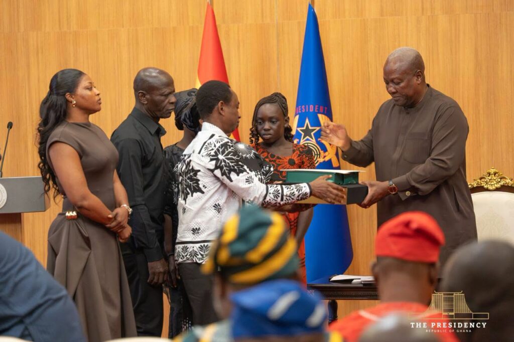 President John Dramani Mahama presents the government’s compensation package to one of the eight bereaved families of the August 6, 2025 helicopter crash victims at the Jubilee House