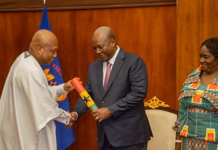 President John Dramani Mahama receiving the roadmap from the Next Step Conference from Minister for Foreign Affairs, Samuel Okudzeto Ablakwa