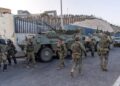 Spain Deploys Military to Ceuta as Thousands of Migrants Cross From Morocco 10 Spanish military stands at the border between the Spanish enclave of Ceuta and Morocco,