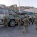 Spain Deploys Military to Ceuta as Thousands of Migrants Cross From Morocco 16 Spanish military stands at the border between the Spanish enclave of Ceuta and Morocco,