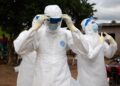 DRC Ebola Response Suffers Major Setback After Centre Burns Down 10 Health workers in personal protective equipment (PPE)