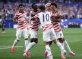 USA, Bosnia Refuse to Abandon Identity Ahead of RO 32 Showdown 3 USMNT players celebrating after scoring against Paraguay in their opening game of the 2026 FIFA World Cup
