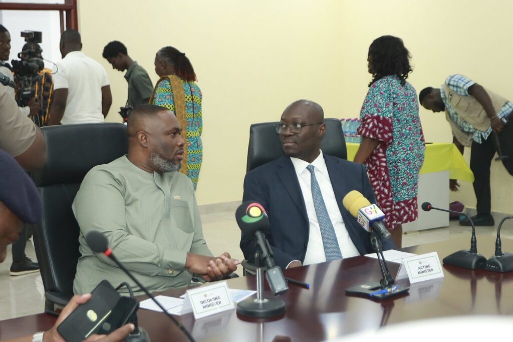 Kenneth Gilbert Adjei, left, seated behind the incoming minister's nameplate beside Dr Cassiel Ato Forson as the handover ceremony gets under way before the media. Photo: Ministry of Defence