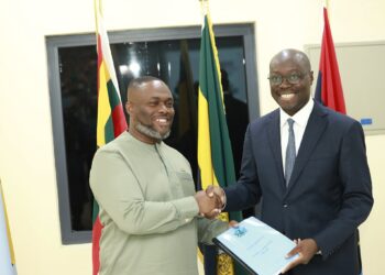 Ato Forson Hands Over Defence Ministry to Kenneth Gilbert Adjei 2 Outgoing Acting Minister for Defence Dr Cassiel Ato Forson, right, hands the Ministry of Defence handing-over notes to the incoming Minister, Kenneth Gilbert Adjei, at the ceremony in Accra. Photo: Ministry of Defence