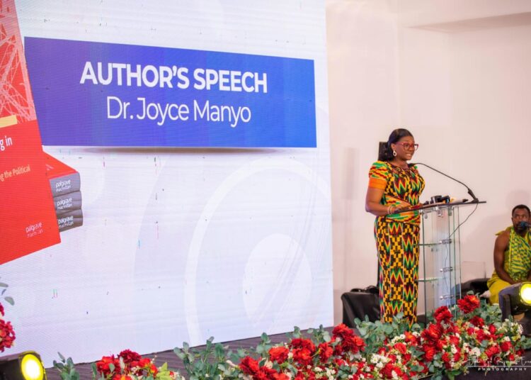 Dr Manyo's Political Branding Book Argues Political Trust Rests on Delivery 1 Dr Joyce Manyo speaks alongside a display of her newly launched book, Political Branding in Ghana, during the event's author's speech segment.
