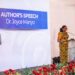 Dr Joyce Manyo speaks alongside a display of her newly launched book, Political Branding in Ghana, during the event's author's speech segment.