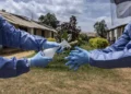 Kenya Intensifies Ebola Response After First Death 7 Health worker in personal protective equipment (PPE) undertaking sanitation measures