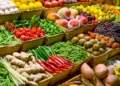 A vibrant display of fresh produce at an open-air market stall