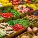 A vibrant display of fresh produce at an open-air market stall