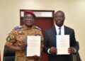 Ghana, Burkina Faso Sign Defence Pact To Secure Trade Corridors 11 Major General Célestin Simporé and Dr Cassiel Ato Baah Forson hold up the French and English texts of the Technical Arrangement on escort and security support for military equipment and convoys