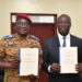 Ghana, Burkina Faso Sign Defence Pact To Secure Trade Corridors 14 Major General Célestin Simporé and Dr Cassiel Ato Baah Forson hold up the French and English texts of the Technical Arrangement on escort and security support for military equipment and convoys