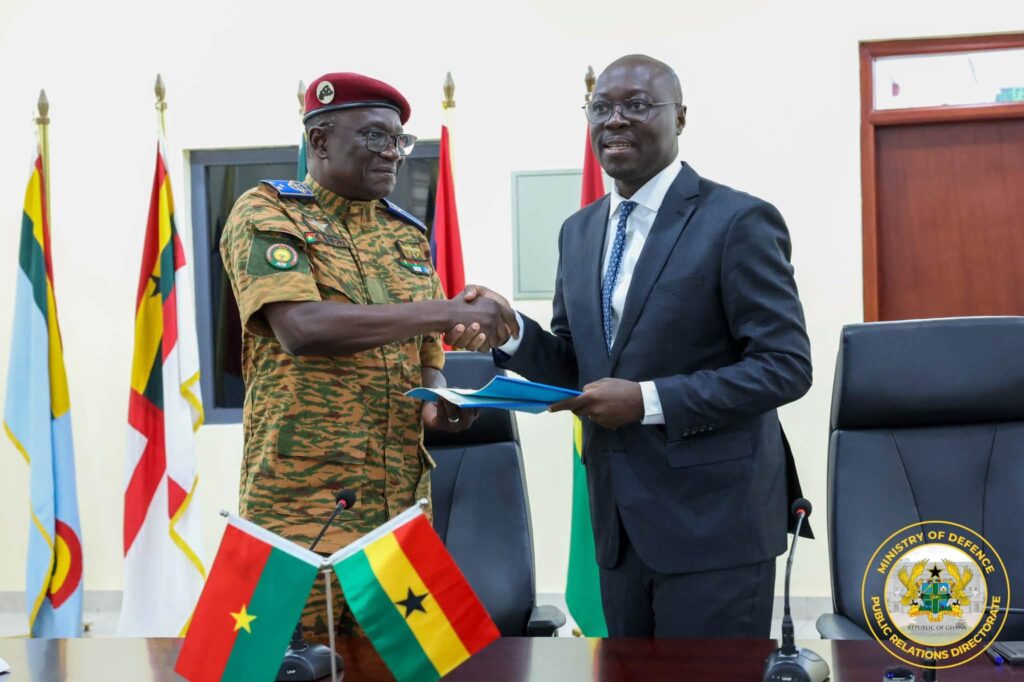 Ghana, Burkina Faso Sign Defence Pact To Secure Trade Corridors 3 Acting Minister for Defence Dr Cassiel Ato Baah Forson exchanges signed copies of the agreement with Burkina Faso's Minister of State and Minister of War and Patriotic Defence, Major General Célestin Simporé. Photo: Ministry of Defence, Public Relations Directorate