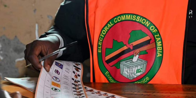 Zambia Suspends Vote Count Over Attacks on Election Officials 1 An election official holds a ballot at a polling station during Zambia's general elections
